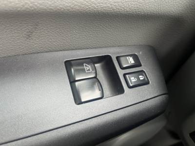 NV Cargo interior showing power window controls and window lock switch on door panel.