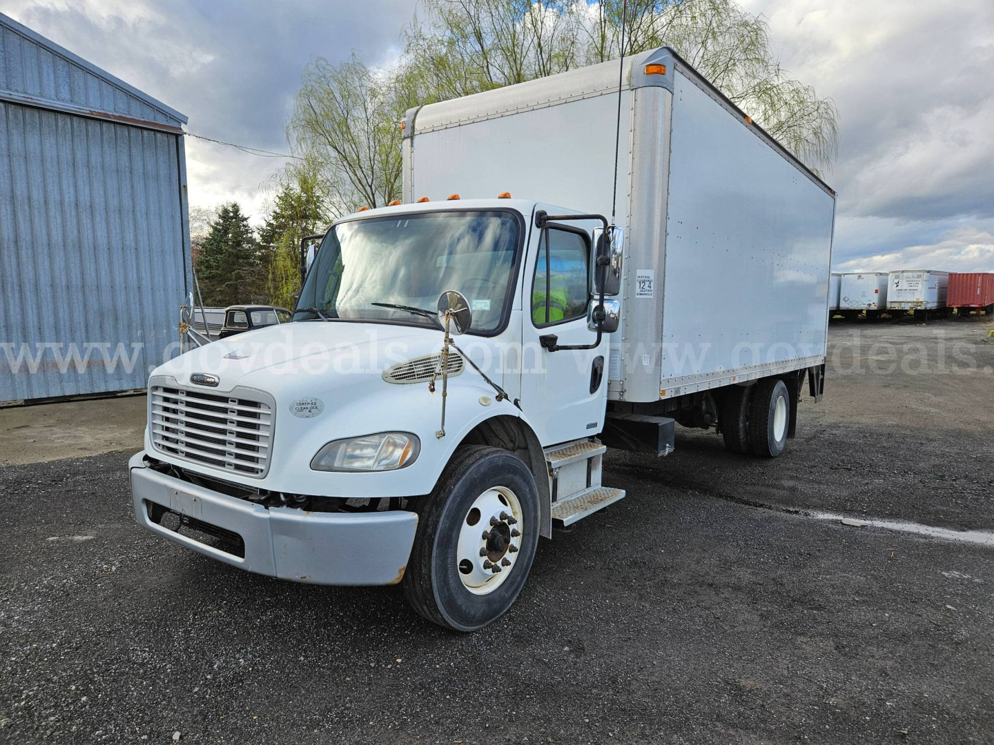 Box truck front-left view showing 2009 Freightliner M2 106 with white cab and box body, VIN sticker area not visible, stock number 32136-15, in outdoor lot.