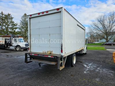 Freightliner M2 106 box truck from rear view showing cargo box and rear bumper.