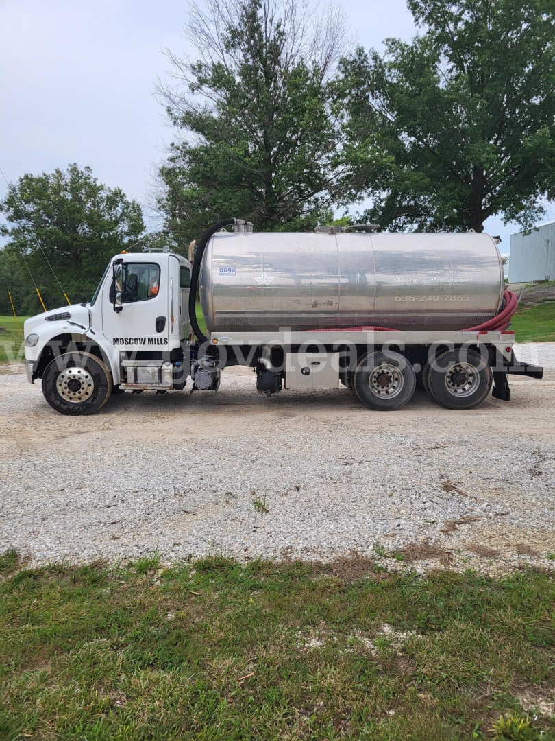Truck side view: 2019 Freightliner M2 Tanker truck with stainless steel cylindrical tank, white cab. Visible text: 'MISSION MILLS' on door, 'tanker' body, nozzle hoses.