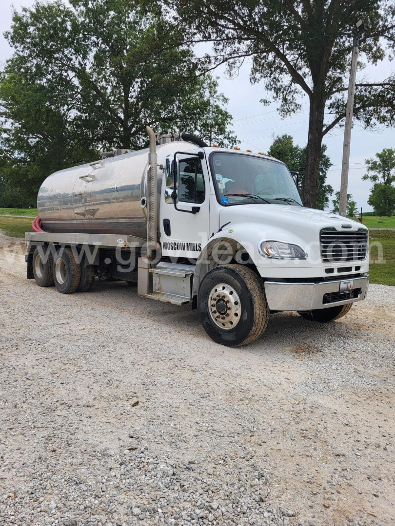 Fuel tanker truck from Freightliner M2 series showing polished aluminum tank and front cab with Stock Number 5111-13.