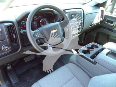 Dashboard and steering wheel of a 2023 Chevrolet Silverado 6500HD interior showing center console, touchscreen, and steering wheel with Chevrolet emblem.