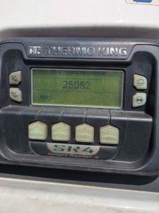 Thermo King SR4 Reefer unit display showing engine hours and control buttons in a utility trailer.
