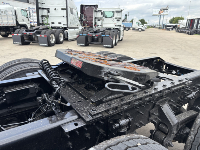 Volvo VNL86 tractor chassis and fifth wheel area showing mounting hardware and frame rails.