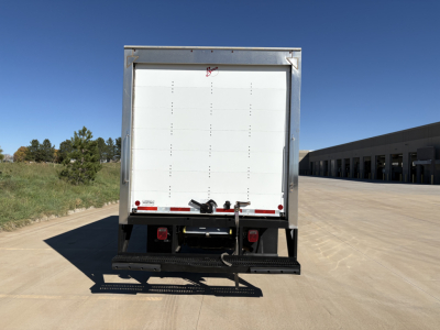Rear view of a 2022 Ford F550 box truck showing cargo area doors and rear bumper.