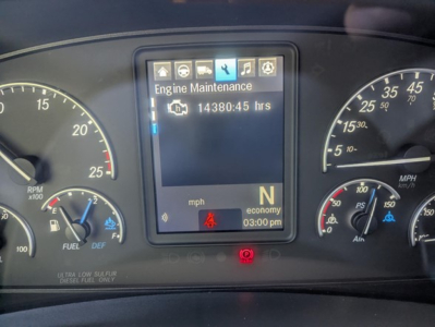 Dashboard view of a 2022 Freightliner Cascadia 126 with Engine Maintenance screen showing 14380.45 hrs, N gear, mph display, and various gauges.