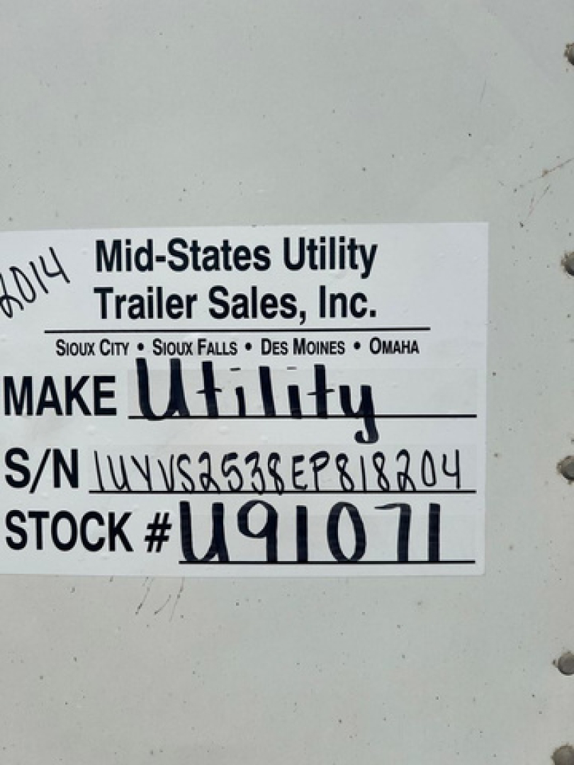 Label on a utility trailer showing Make Utility, S/N 1UYVS2538EP818204, STOCK # U91071, Mid-America Utility Trailer Sales, Inc.