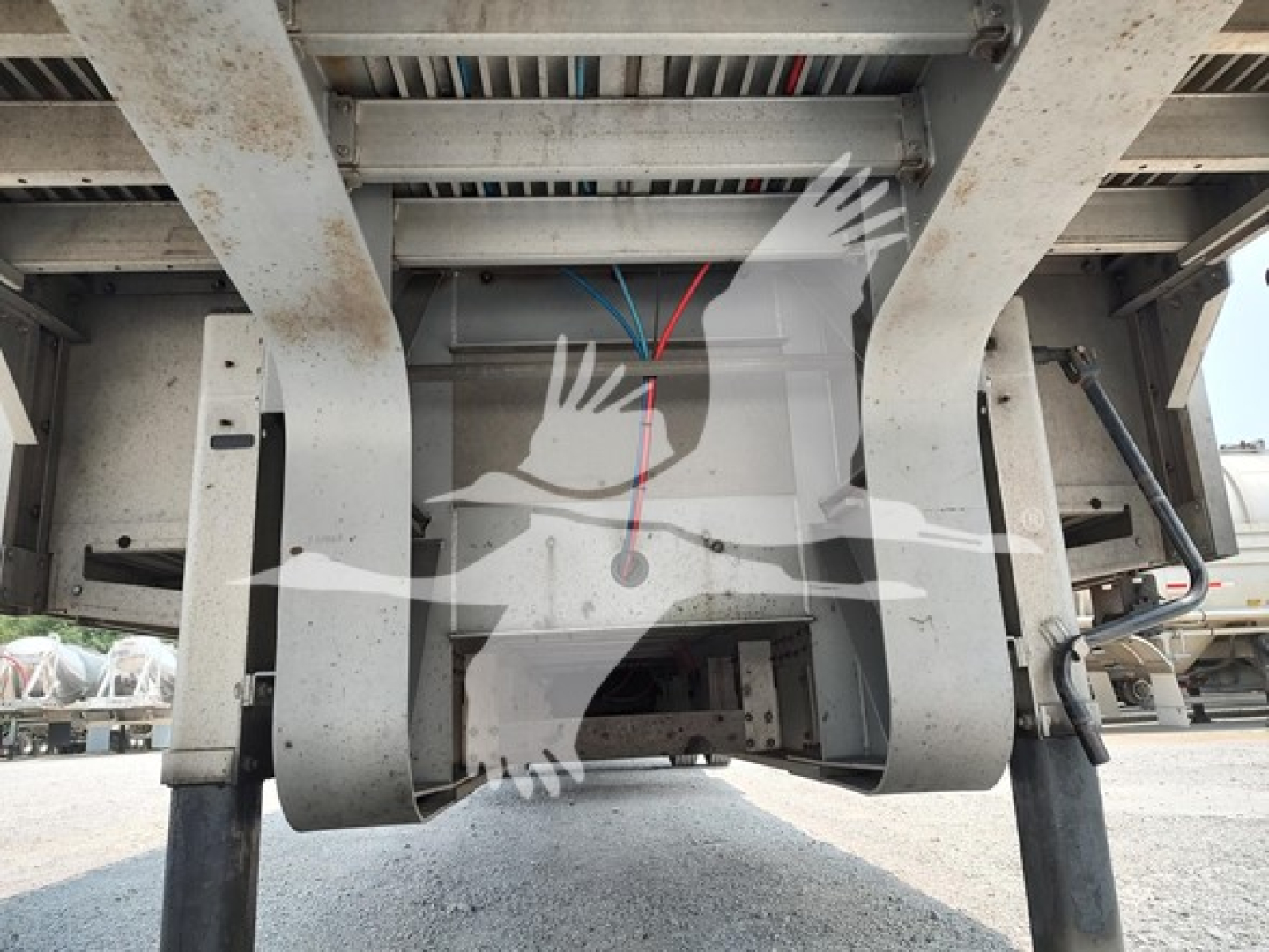 Trailer undercarriage showing wiring harness and frame of a 2018 Reitnouer Dropmiser trailer.