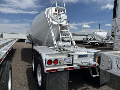 Trailer rear view showing Polar gravity drop pneumatic trailer with ladder and dual rear tires