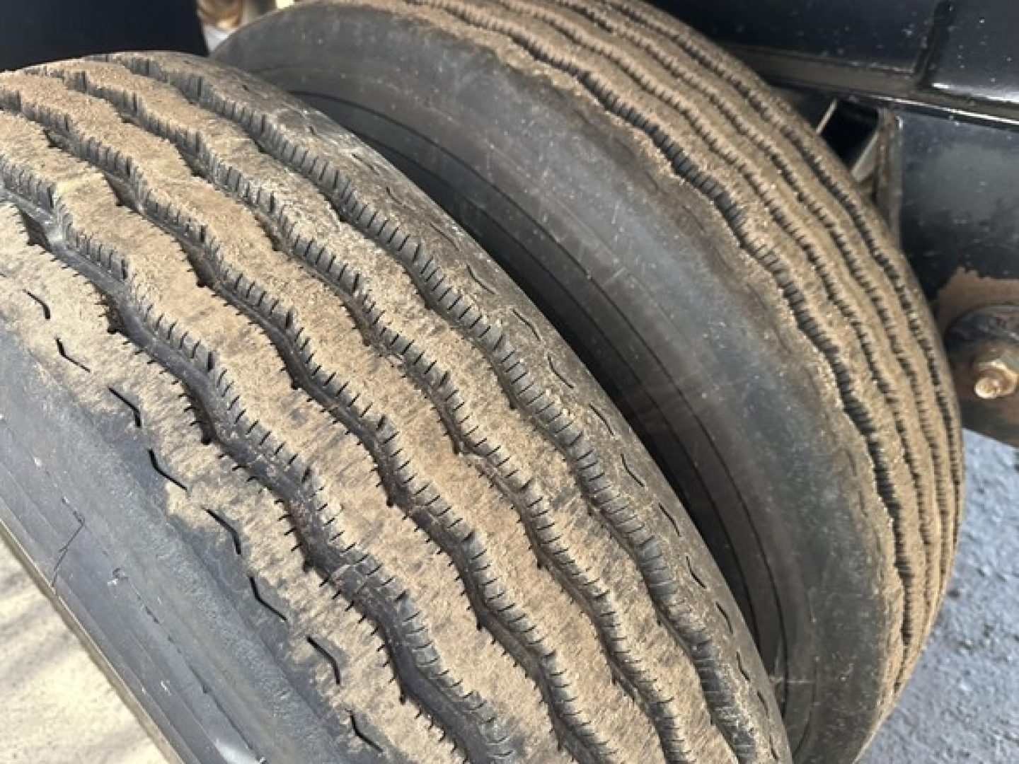 Fontaine Infinity trailer wheel close-up showing dual tires and tread pattern.