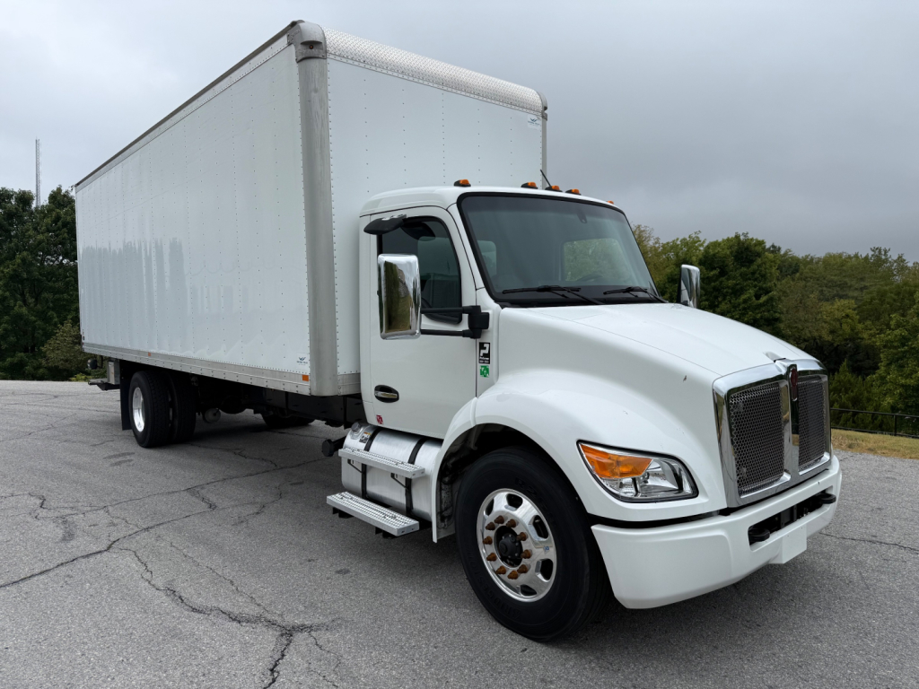 Kenworth T380 box truck with white cab and large cargo box, side view showing front grille, bumper, and dual rear wheels.