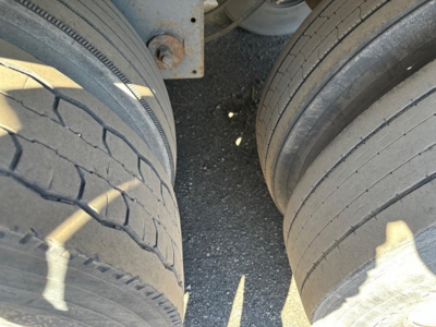 Tyre pair view under Hyundai air ride dry van trailer showing tread and sidewall patterns.