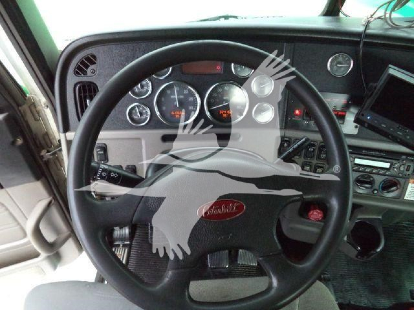 Peterbilt 367 interior steering wheel and dashboard showing instrumentation and controls.