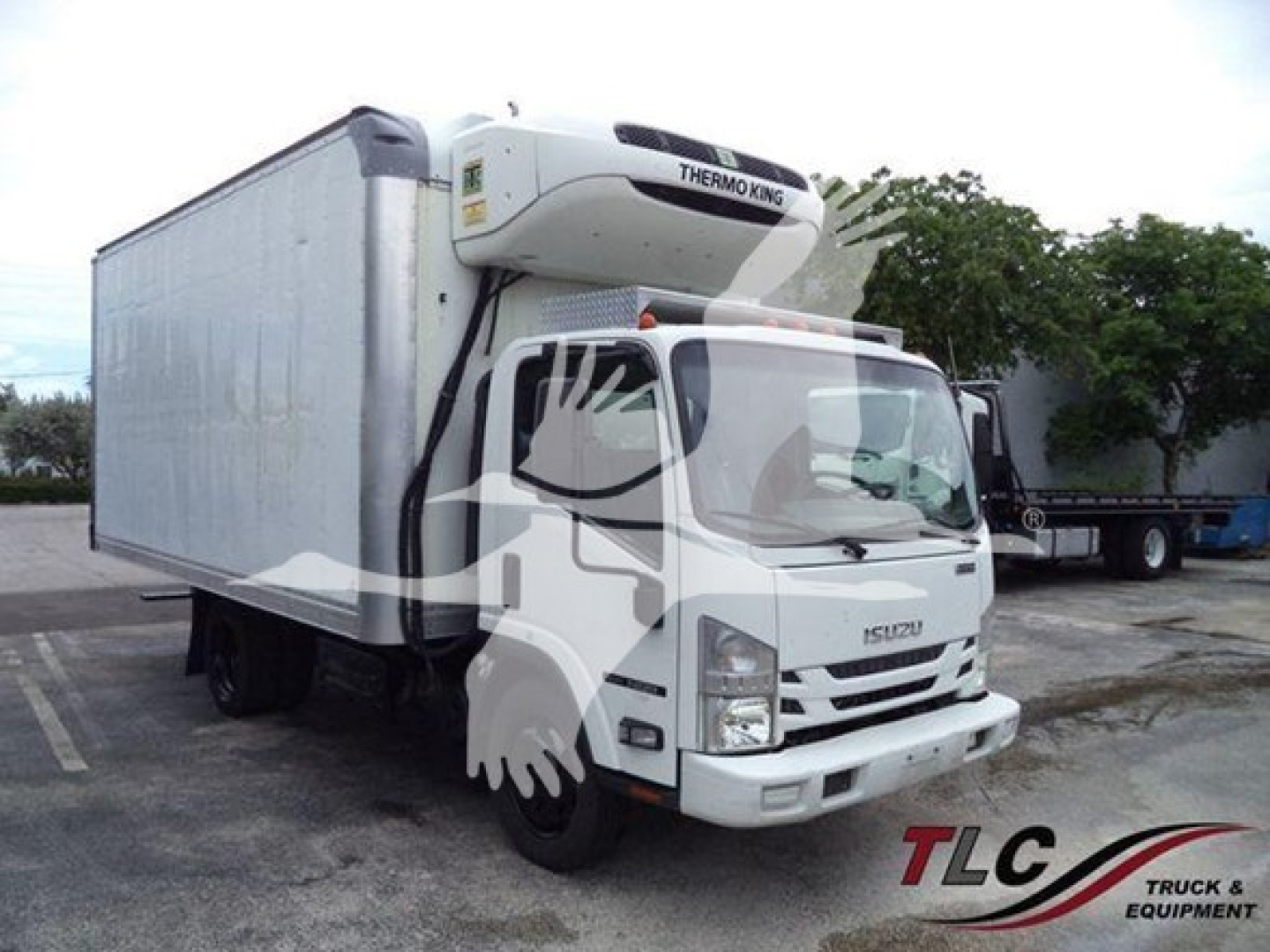 Isuzu NQR refrigerated truck with Thermo King unit on rooftop side view showing cargo box and cab details