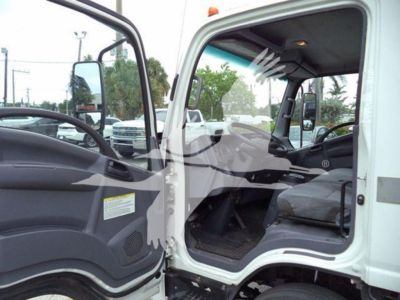 Isuzu NQR cab interior and entry shown from open driver door, white refrigerated truck with gray interior, dashboard and steering visible.