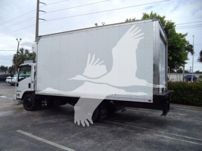 Isuzu NQR refrigerated box truck in-service showing cargo area side with white graphic of birds; cab visible left, rear wheels and undercarriage visible.