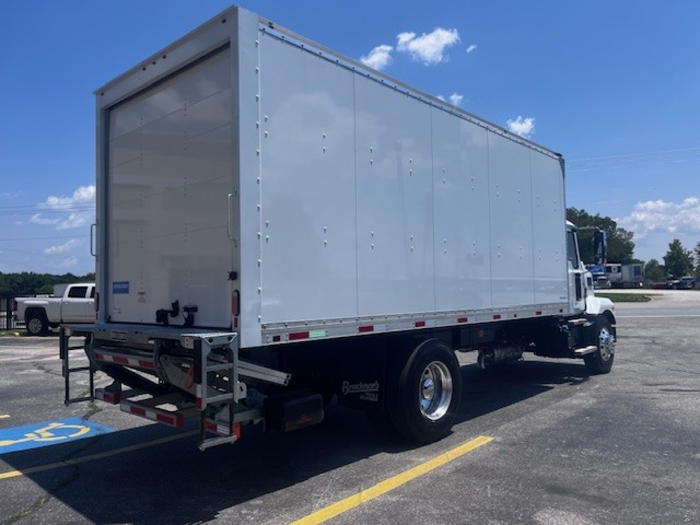 Box truck from rear-right side showing cargo box and tandem rear wheels. Visible text: 'Box' on listing context? Not on image. No readable text other than truck components.
