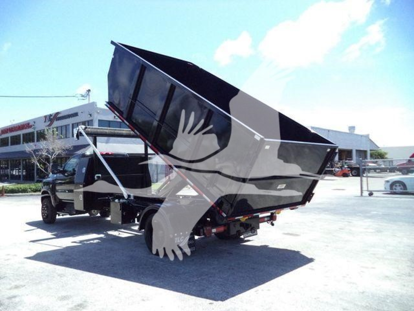 Dump truck with raised bed in a parking lot. Visible text: Stock Number CV515REG14SNG1. Category: Rolloff. Type: Trucks. New Used: New.