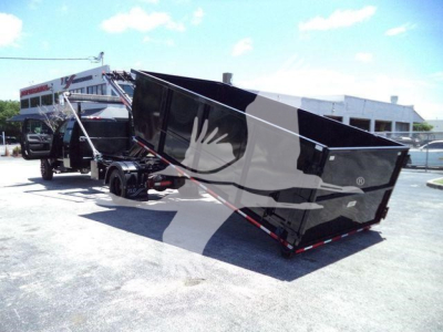Rolloff truck with black dump container attached to a truck, in-service showing side view and loading area.