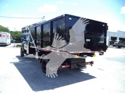 2023 International CV roll-off truck rear angled view showing cargo container with side panels and rear bumper; no visible serial numbers or text legible on image beyond generic truck details.