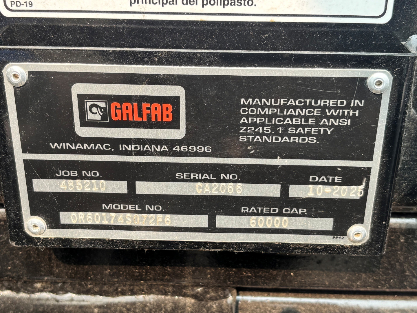 GalFab plate on Mack equipment showing job no., serial no. CA2066, date 10-2025, model no. OR601... and 60000 rated gap. Includes GalFab Winamac Indiana label and compliance text.