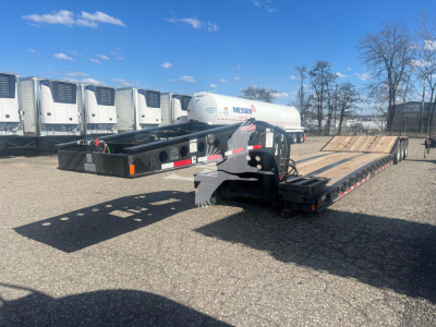  Fontaine 55 PVR Pro lowboy trailer with flatbed deck and HPI gas tank visible, in-service showing hydraulic components and rear ramps.
