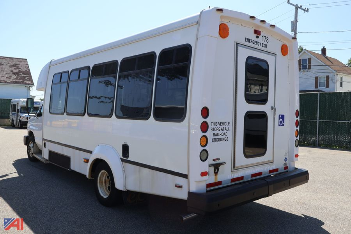 Ford E450 wheelchair bus rear view showing emergency exit door and accessibility markings