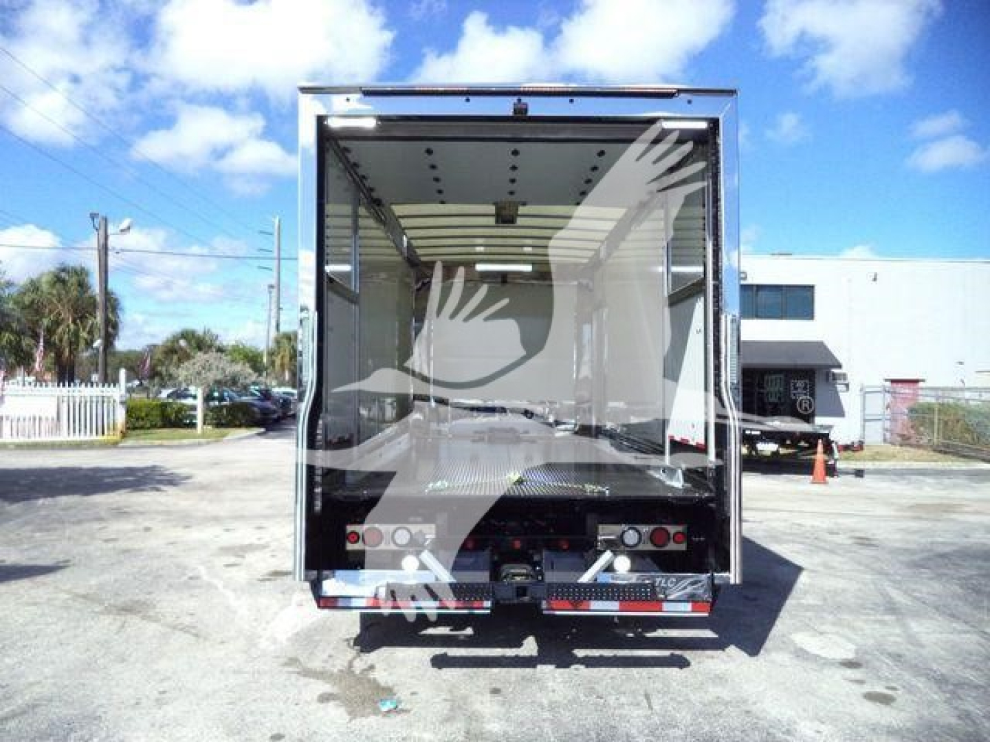 Mack MD6 rollback truck box rear view showing empty cargo area and rear lights