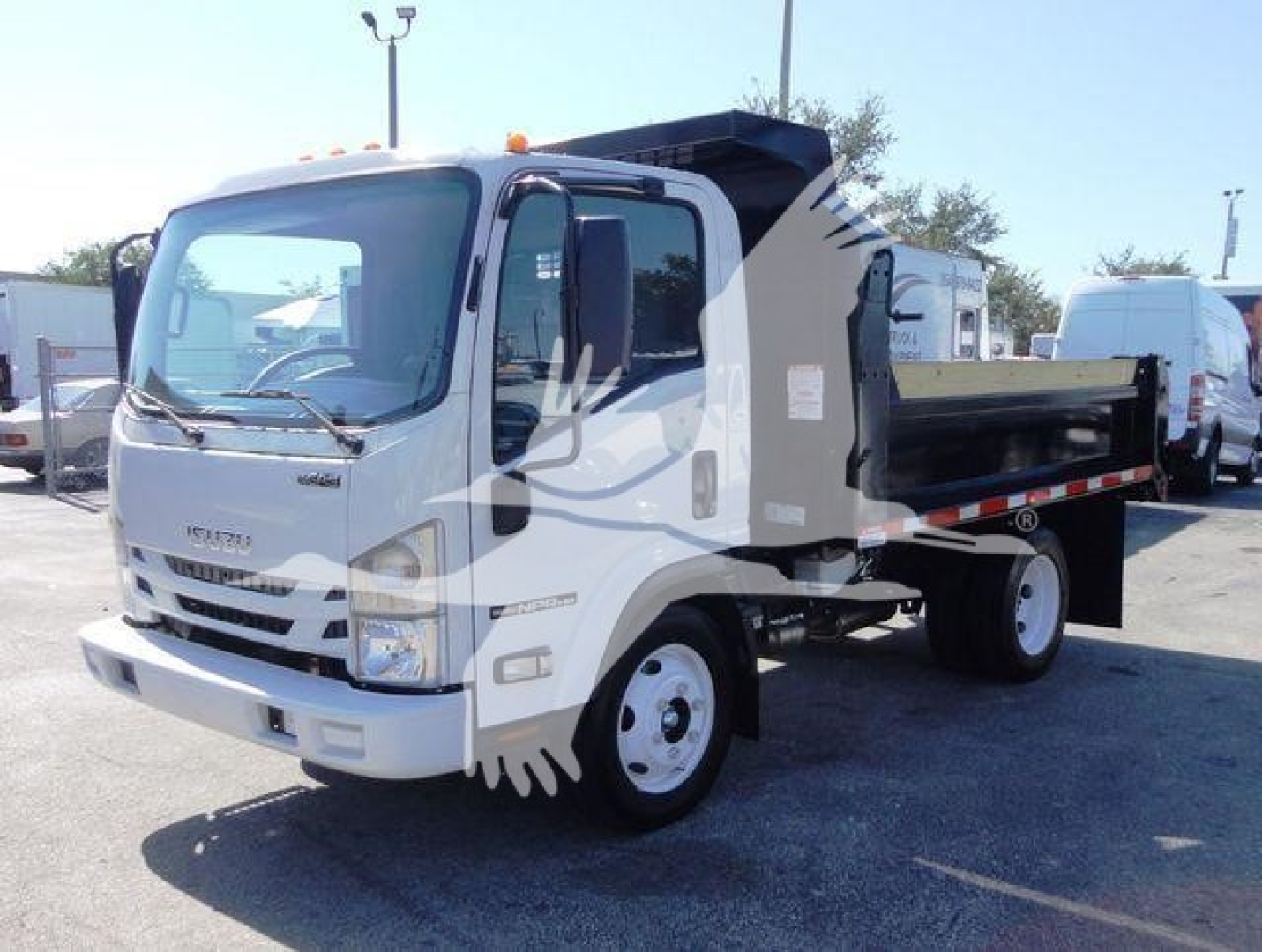 Isuzu NPR HD dump truck in white with dump bed, front view, side pallet.