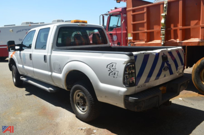 Ford F-250 Super Duty pickup truck 4x4 rear view showing cargo bed and striped tailgate markings.