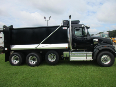 Western Star 49X dump truck side view showing black dump body with chrome steps and wheels, stock number 346820, new vehicle.