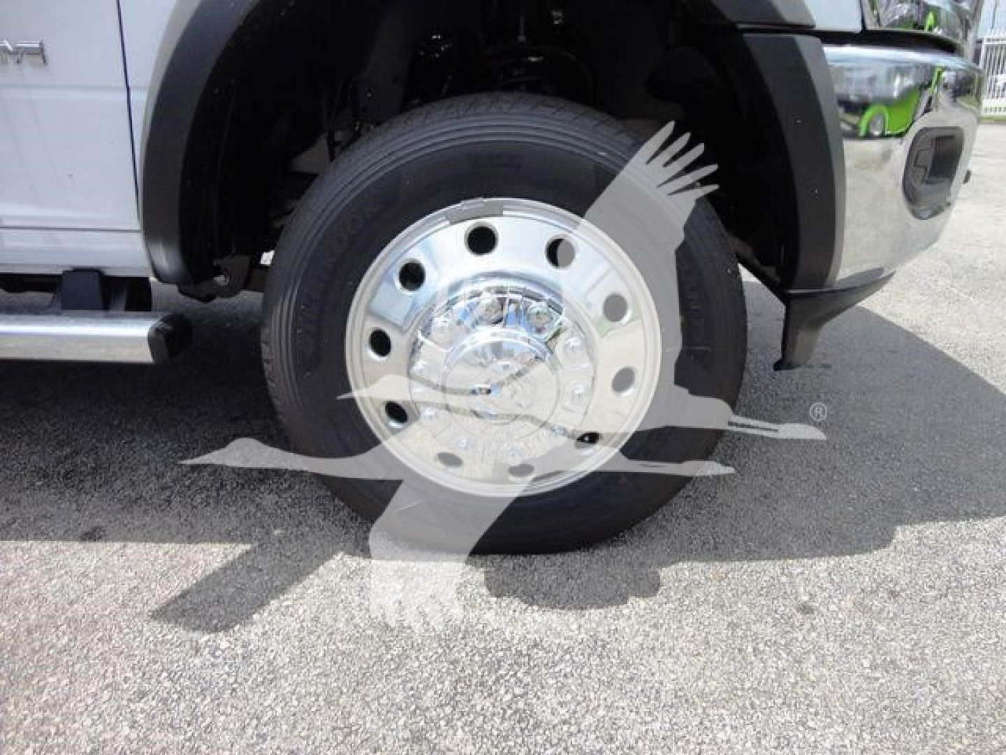 Front wheel and tire of a Ram 4500 truck showing chrome hubcap and wheel well.