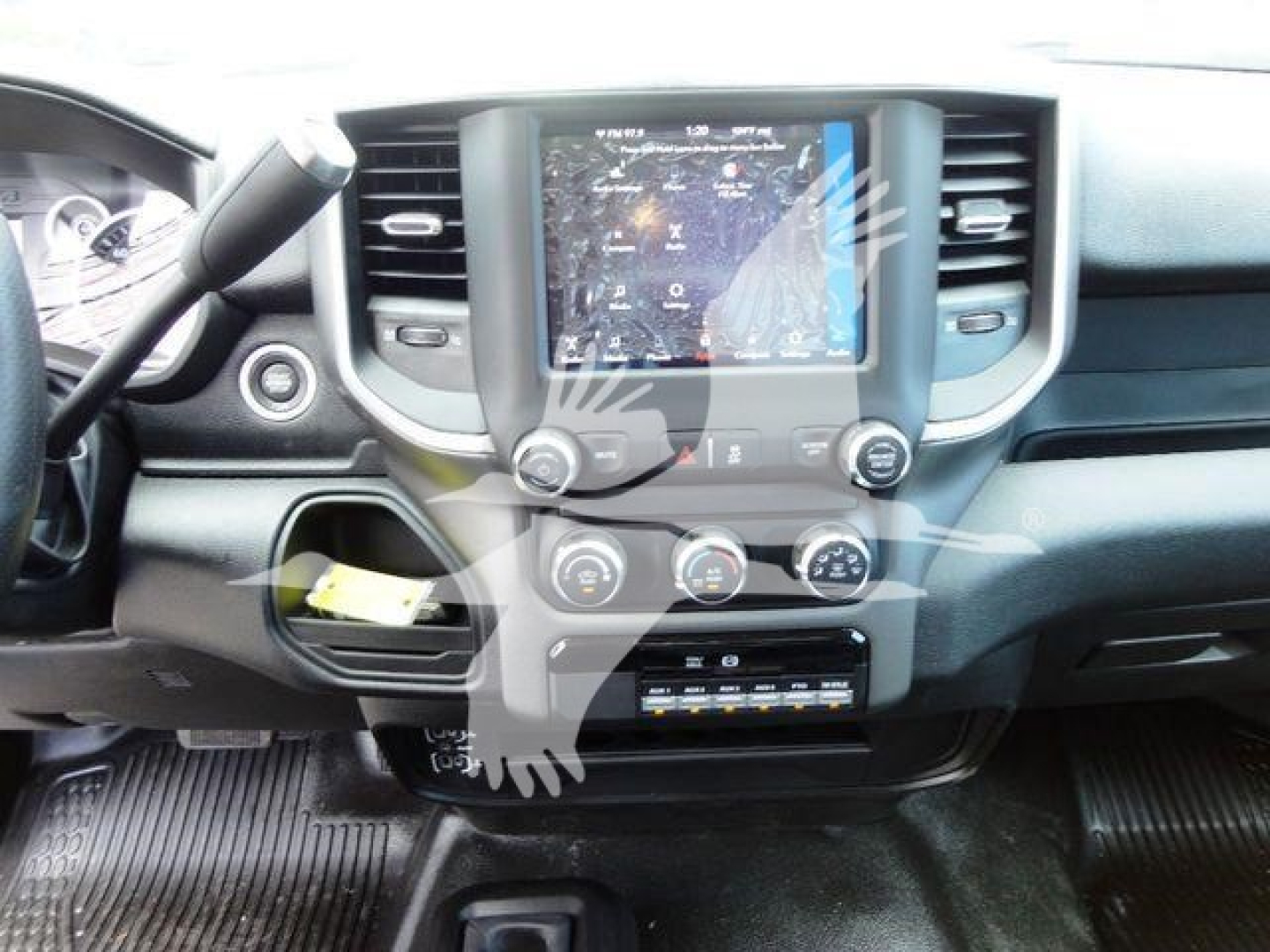 Ram 4500 interior cargo space showing center touchscreen display and climate controls. Dashboard, steering wheel, and lower storage area visible.