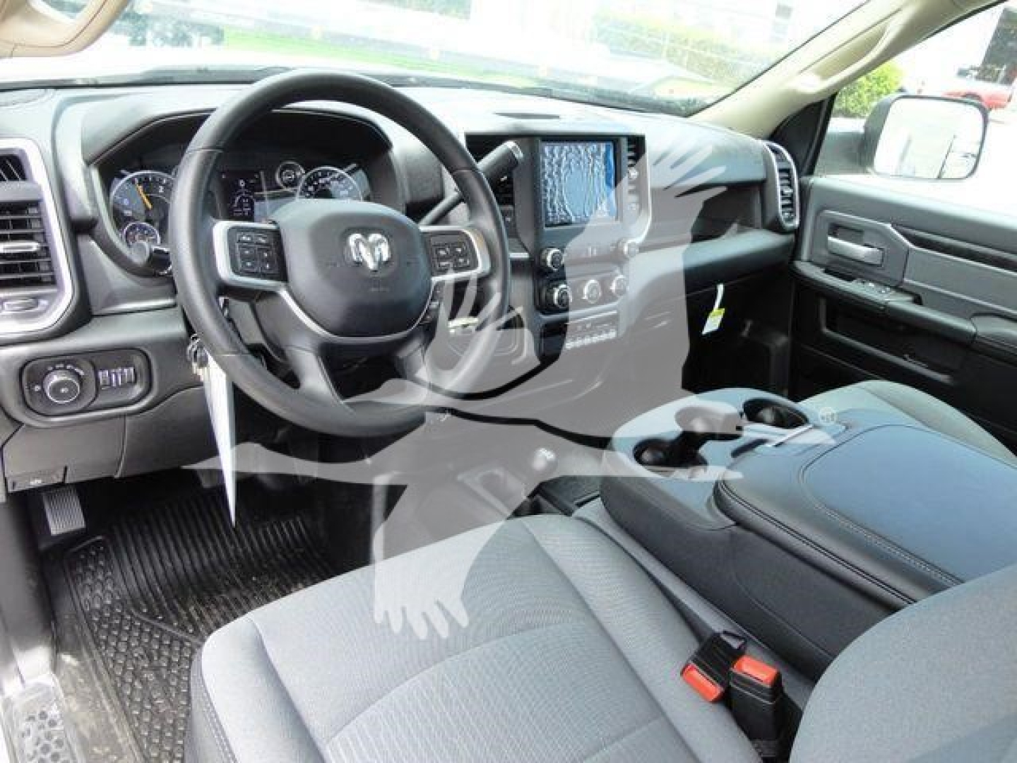 Ram 4500 SLT truck interior showing steering wheel with Ram emblem and center touchscreen display