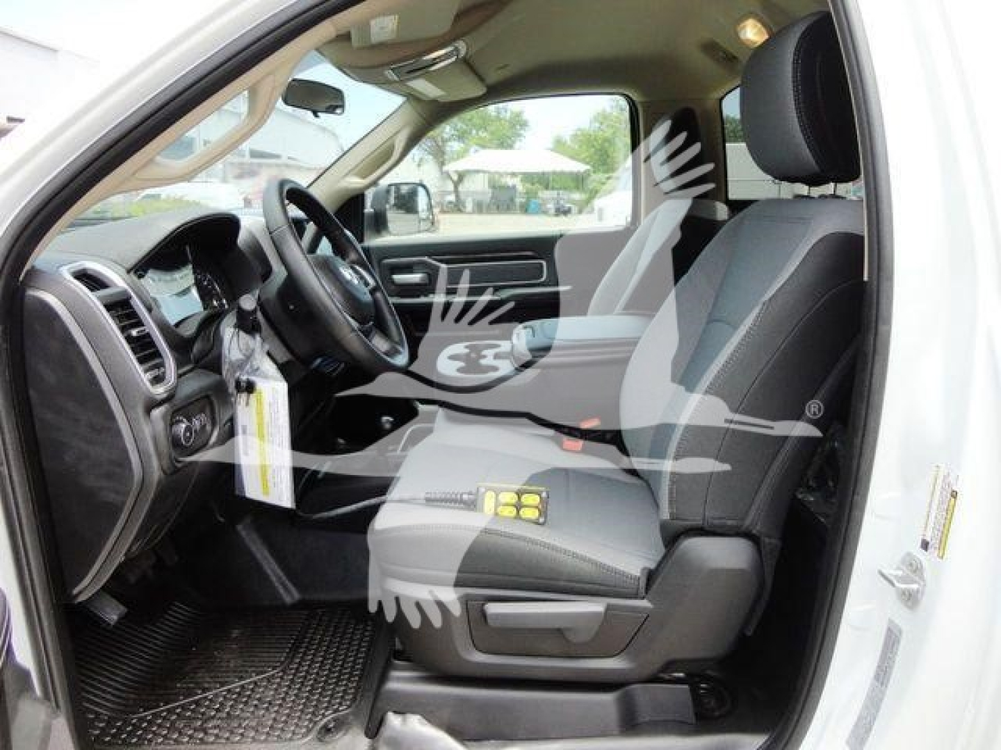 Ram 4500 SLT truck interior view showing driver and front passenger seats with dash and steering wheel.