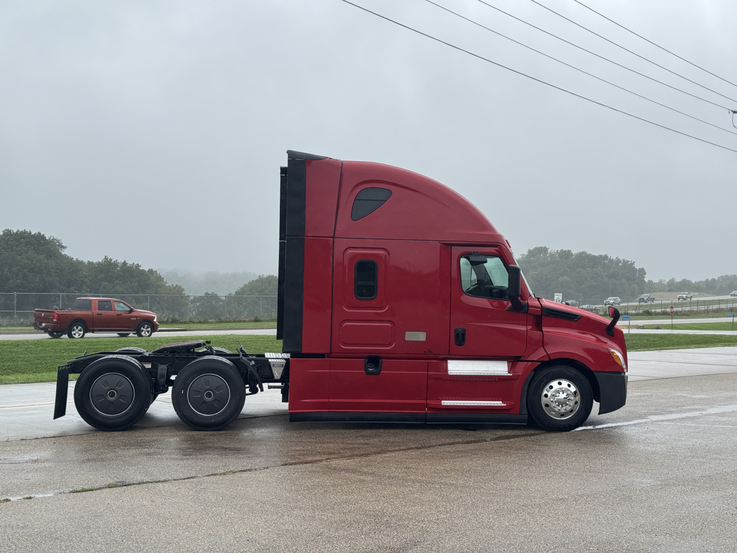Truck cabin side profile of a red Freightliner Cascadia 126 conventional sleeper, 6x2 rear axles, with stock number 2608091 visible.