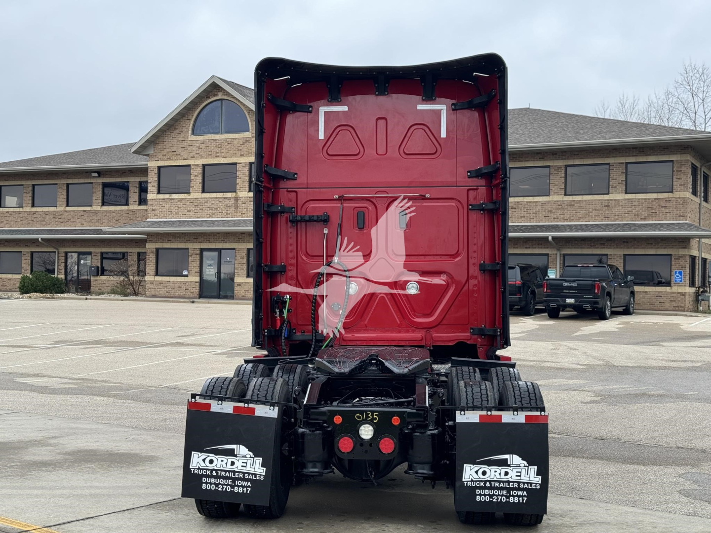 Freightliner Cascadia rear view showing fifth wheel and chassis with Kordell mud flaps and tail area.