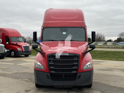 Freightliner Cascadia 126 truck front view showing bold grille, headlights, and large side mirrors.