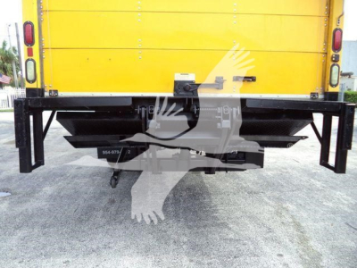 Rear view of a yellow 2018 International Durastar 4300 box truck showing bumper and hitch area.