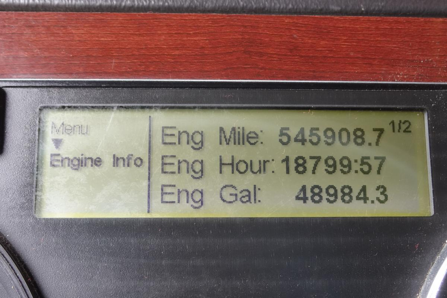 Driver display showing engine mileage data: Eng Mile: 545908.7, Eng Hour: 18799.57, Eng Gal: 48984.3 with Menu and Engine Info labels on left.