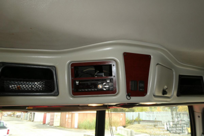 Cab interior overhead showing stereo head unit and storage panels in a Western Star 5700XE truck cab interior