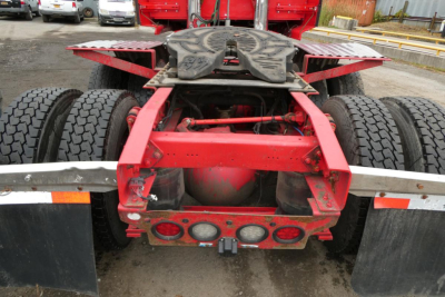 Rear view of a 2019 Western Star 5700XE tractor chassis showing fifth wheel, suspension, and dual rear axles.