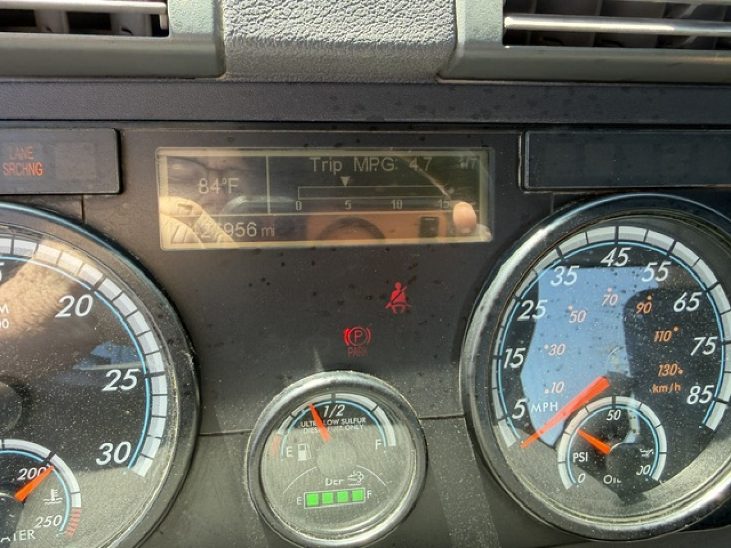 Dashboard view of a 2017 Freightliner Cascadia CA125DC showing instrument cluster, fuel gauge, and trip MPG display.