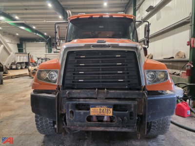 Front view of a 2019 Freightliner 114 SD Dump Truck showing black grille, orange cab, and New York license plate B-4785.