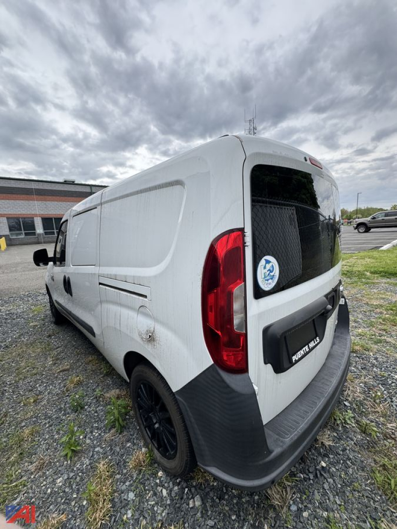 Cargo van showing rear and side of a white 2018 Ram ProMaster City/Promaster ST with black rear bumper and taillights.