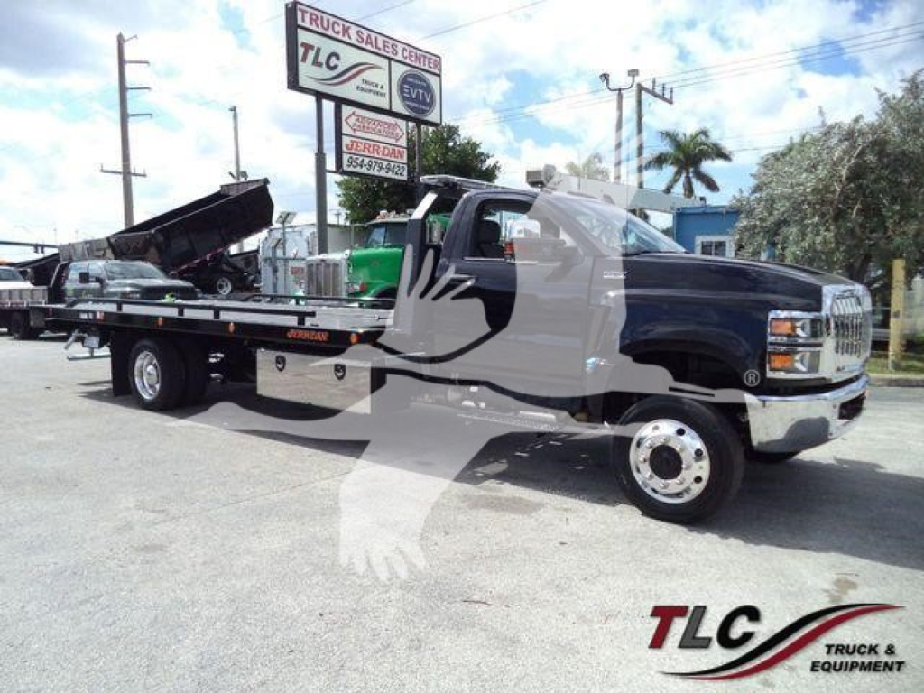 International CV rollback tow truck in a lot with a black cab and flatbed, VIN 1HTKTSWK6PH441635 visible on listing, stock J41635.