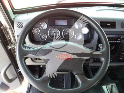 Peterbilt 337 dashboard and steering wheel view showing gauges and controls
