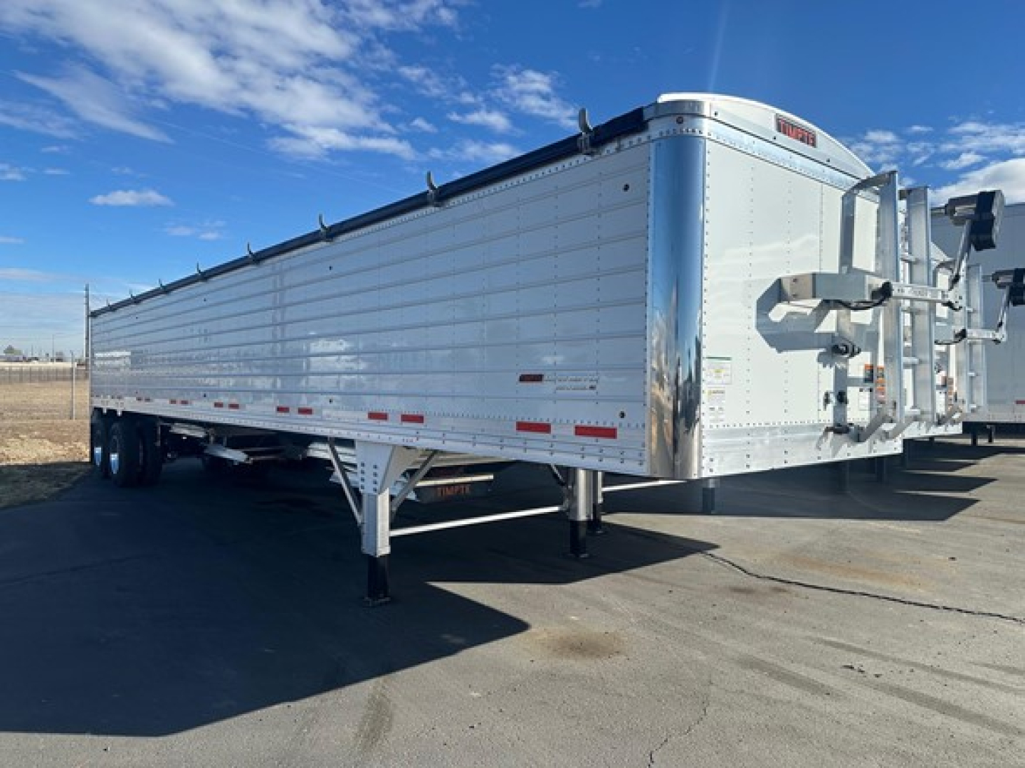 Timpte Super Hopper trailer with 66 inch sides, aluminum sides and front tack area visible.