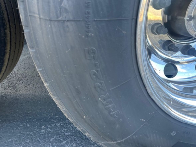 Blemish-free tire and chrome wheel of a 2026 Timpte Super Hopper trailer showing 66 inch sides.