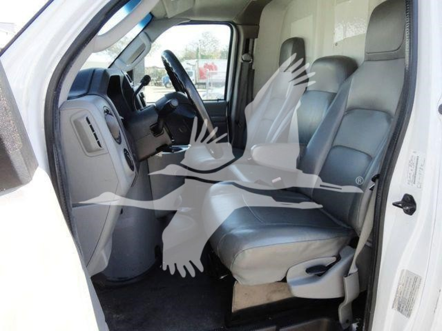 Ford E-450 cab interior showing front seats and steering wheel